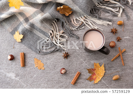 hot chocolate, autumn leaves and warm blanket 57259129