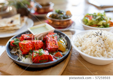 close up of paneer tikka dish with sauce on table 57259503