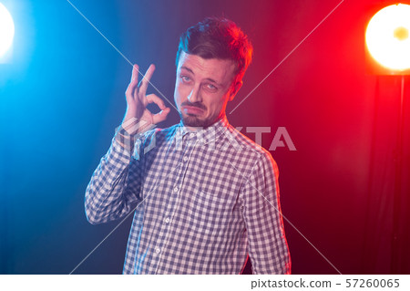 Portrait of young happy smiling attractive man with okay gesture Portrait of young happy smiling attractive man with okay gesture 57260065