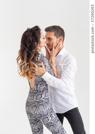 Passionate couple dancing social danse kizomba or bachata or semba or taraxia on white background 57260263