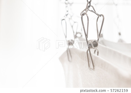 Dry the washed towels in the room. Dry the laundry indoors. Housework/daily life image. 57262159