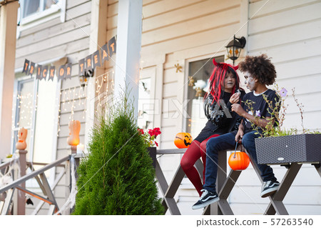 Kids eating Candy on Halloween Kids eating Candy on Halloween 57263540