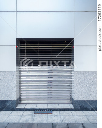 Automatic Factory Shutter Roller Door Indoor, Steel Rolling Gate Door for Security System of Warehouse Storage. Architecture Metal Access Doorway With Granite Wall Background of Workshop Store 57263559