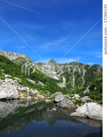 Tengu pond and Yagatake volcano Tengu pond and Yagatake volcano 57266130