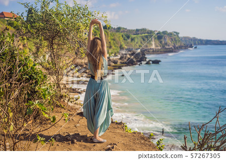 Young woman tourist on Pantai Tegal Wangi Beach, Bali Island, Indonesia. Bali Travel Concept 57267305