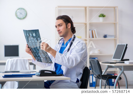 Young male doctor working in the clinic 57268714