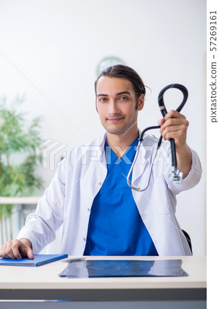 Young male doctor working in the clinic 57269161