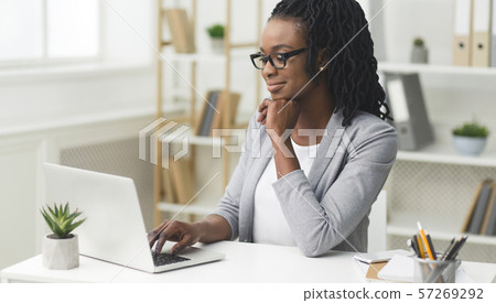 Afro Female Entrepreneur Working On Laptop At Workplace 57269292