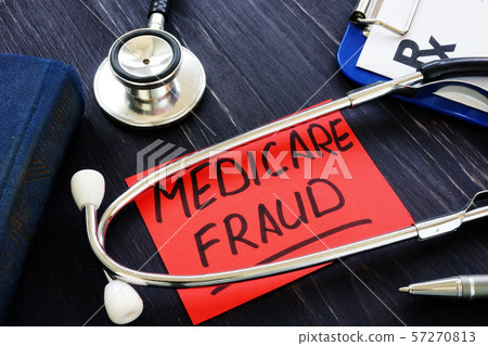 Medicare fraud sign and stethoscope with papers. Medicare fraud sign and stethoscope with papers. 57270813
