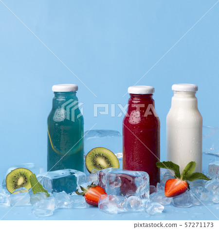 Detox fruit infused flavoured detox cocktails on blue background Detox fruit infused flavoured detox cocktails on blue background 57271173