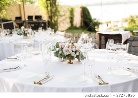 Wedding table setting decorated with fresh flowers Wedding table setting decorated with fresh flowers 57273950