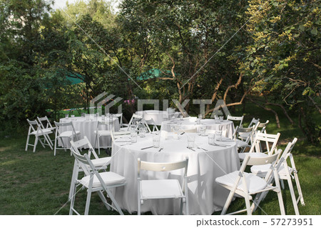 Wedding table setting decorated with fresh flowers Wedding table setting decorated with fresh flowers 57273951