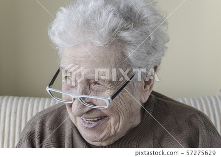 Happy senior woman wearing eyeglasses Happy senior woman wearing eyeglasses 57275629