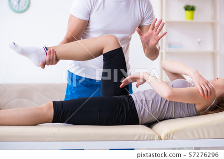 Young woman visiting male doctor physiotherapist Young woman visiting male doctor physiotherapist 57276296