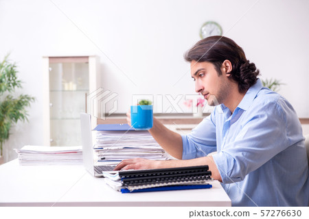 Young male employee working at home 57276630