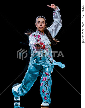 woman Tai Chi Chuan Tadjiquan posture isolated black background light painting woman Tai Chi Chuan Tadjiquan posture isolated black background light painting 57276660