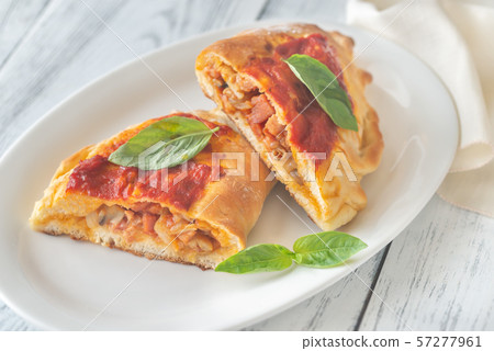 Homemade calzone on the plate 57277961