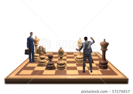 Businessman in large chess board in strategy concept 57279857
