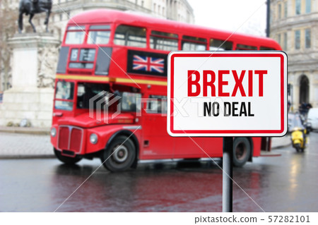 Blurred London street view with red double decker bus and Brexit no deal sign in rainy day. Possible Blurred London street view with red double decker bus and Brexit no deal sign in rainy day. Possible 57282101