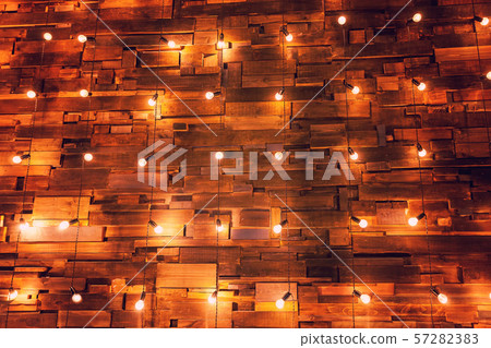Wooden planks with lamps background. Decorated interior room with gold lights Wooden planks with lamps background. Decorated interior room with gold lights 57282383