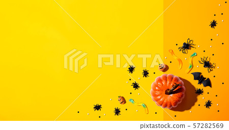 Pumpkins with Halloween decorations 57282569