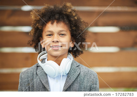 African boy with headphones outdoors African boy with headphones outdoors 57282783