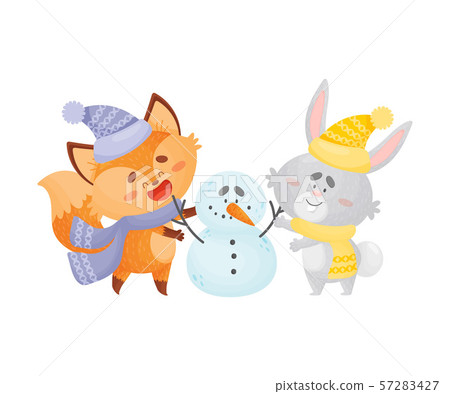 Cartoon foxes and hare sculpt a snowman. Vector illustration on a white background. 57283427