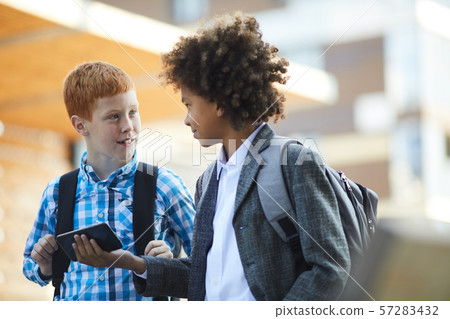 Schoolboys with mobile phone Schoolboys with mobile phone 57283432