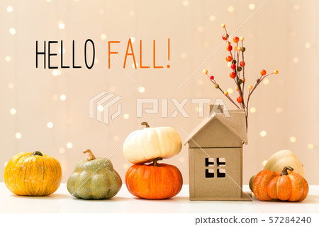 Hello fall message with pumpkins with a house 57284240
