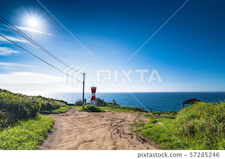 Red lighthouse ahead of the morning cape 57285246