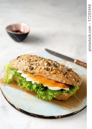 Healthy sandwich with salmon on white background 57285948