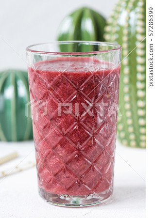 Red beet, blueberry and strawberry smoothie in a glass Red beet, blueberry and strawberry smoothie in a glass 57286399