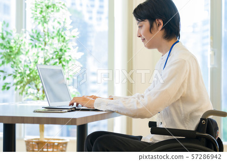 Wheelchair business man desk work Wheelchair business man desk work 57286942