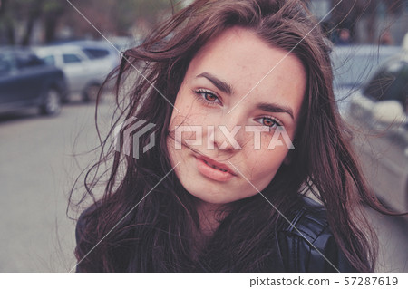 Sad girl looking at camera bend her neck 57287619