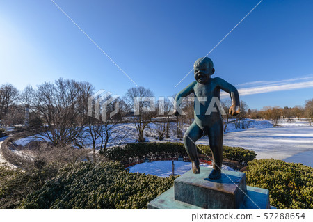 Oslo winter landscape at famous Angry Boy Statue in Vigeland Sculpture Park 57288654