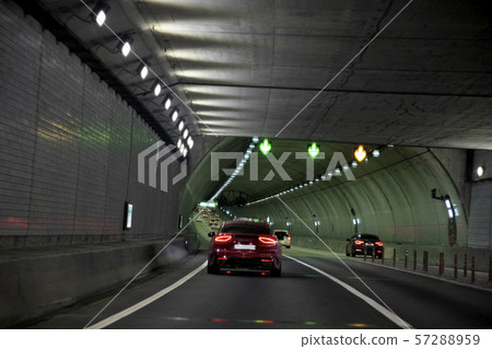 A car running in a tunnel 57288959