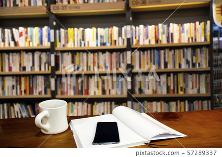 An open book on the table An open book on the table 57289337