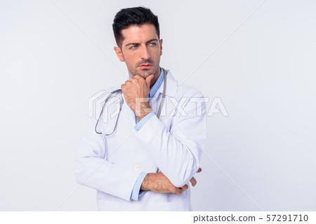Portrait of young handsome man doctor thinking Portrait of young handsome man doctor thinking 57291710