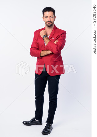 Full body shot of young handsome bearded businessman in red suit Full body shot of young handsome bearded businessman in red suit 57292540