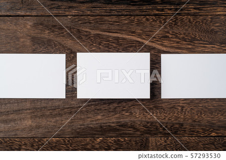 top view of white business card on wood floor top view of white business card on wood floor 57293530