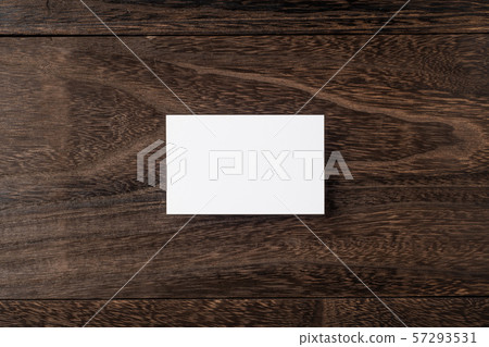top view of white business card on wood floor top view of white business card on wood floor 57293531
