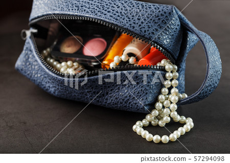 Bag for cosmetics and jewelry made of genuine dark Bag for cosmetics and jewelry made of genuine dark 57294098