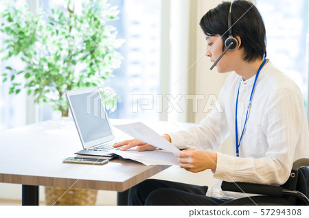 Wheelchair business man deskwork operator Wheelchair business man deskwork operator 57294308