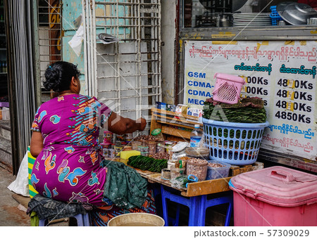 Selling street food in Yangon, Myanmar Selling street food in Yangon, Myanmar 57309029