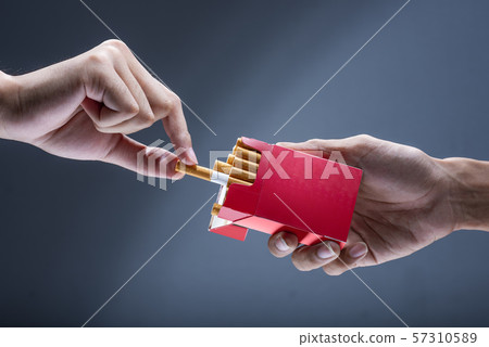 Man offer a cigarette to other people Man offer a cigarette to other people 57310589