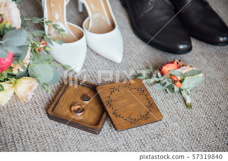 Wedding floristics and details. Wedding invitations on floor. Wedding floristics and details. Wedding invitations on floor. 57319840