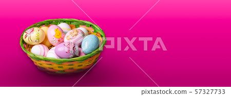 Wicker basket with Easter eggs hand painted on color tabletop background Wicker basket with Easter eggs hand painted on color tabletop background 57327733