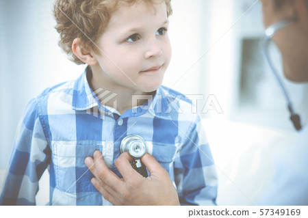 Doctor and patient child. Physician examining little boy. Regular medical visit in clinic. Medicine Doctor and patient child. Physician examining little boy. Regular medical visit in clinic. Medicine 57349169