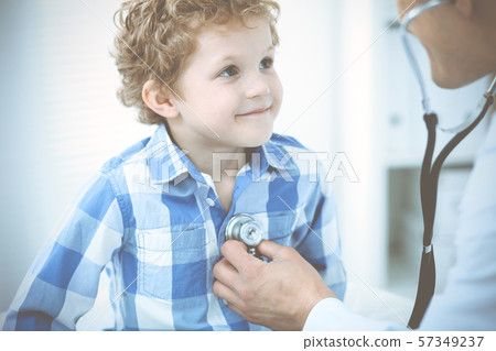 Doctor and patient child. Physician examining little boy. Regular medical visit in clinic. Medicine Doctor and patient child. Physician examining little boy. Regular medical visit in clinic. Medicine 57349237