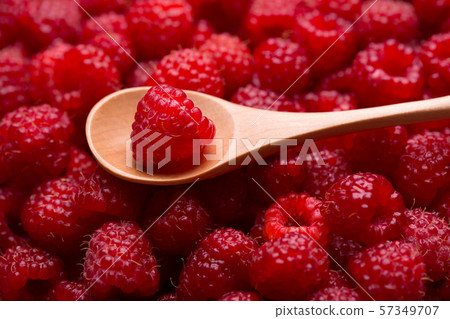 Raspberry berry in a wooden spoon. Raspberry berry in a wooden spoon. 57349707